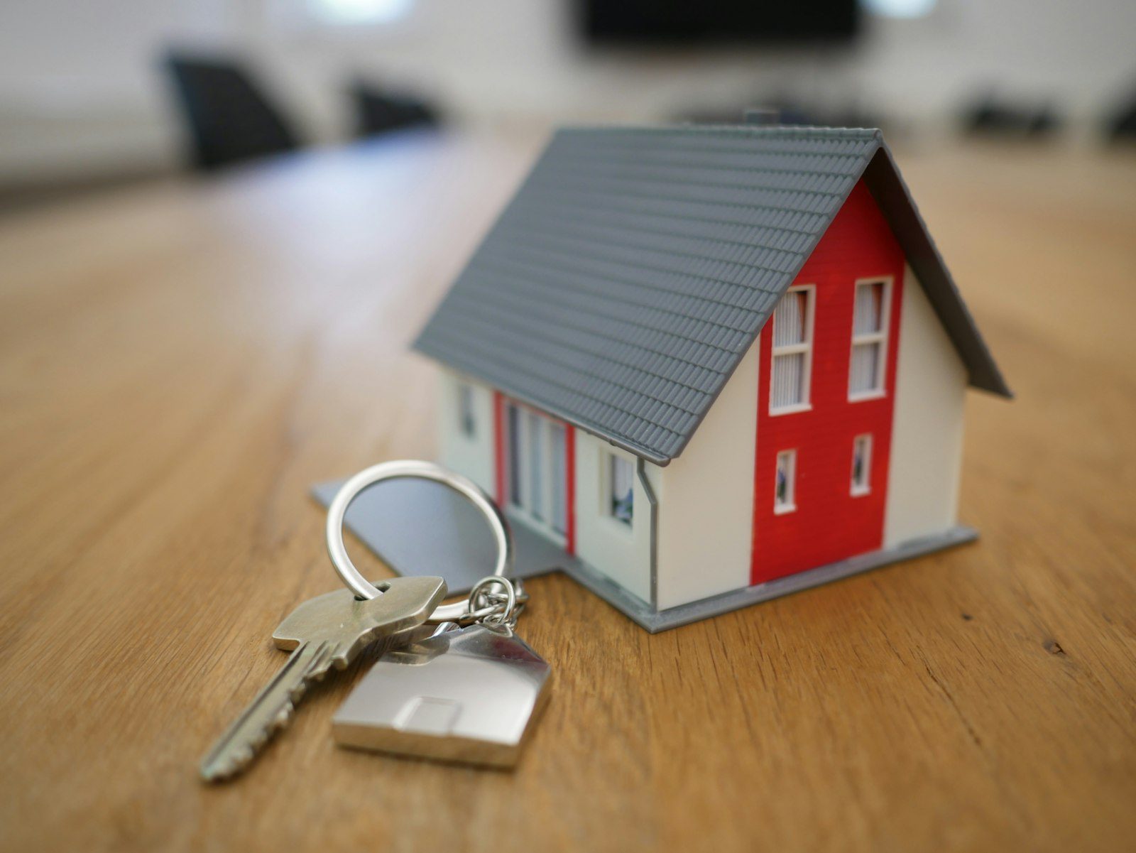House keys next to a small model house